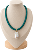 A teal beaded necklace with a baroque pearl pendant and gold clasp, displayed on a beige fabric jewelry bust.